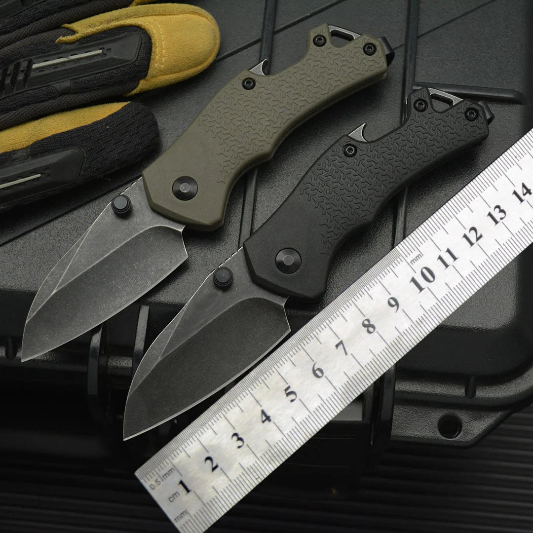 High hardness camping survival knife set with black and green blades next to a ruler for size reference.